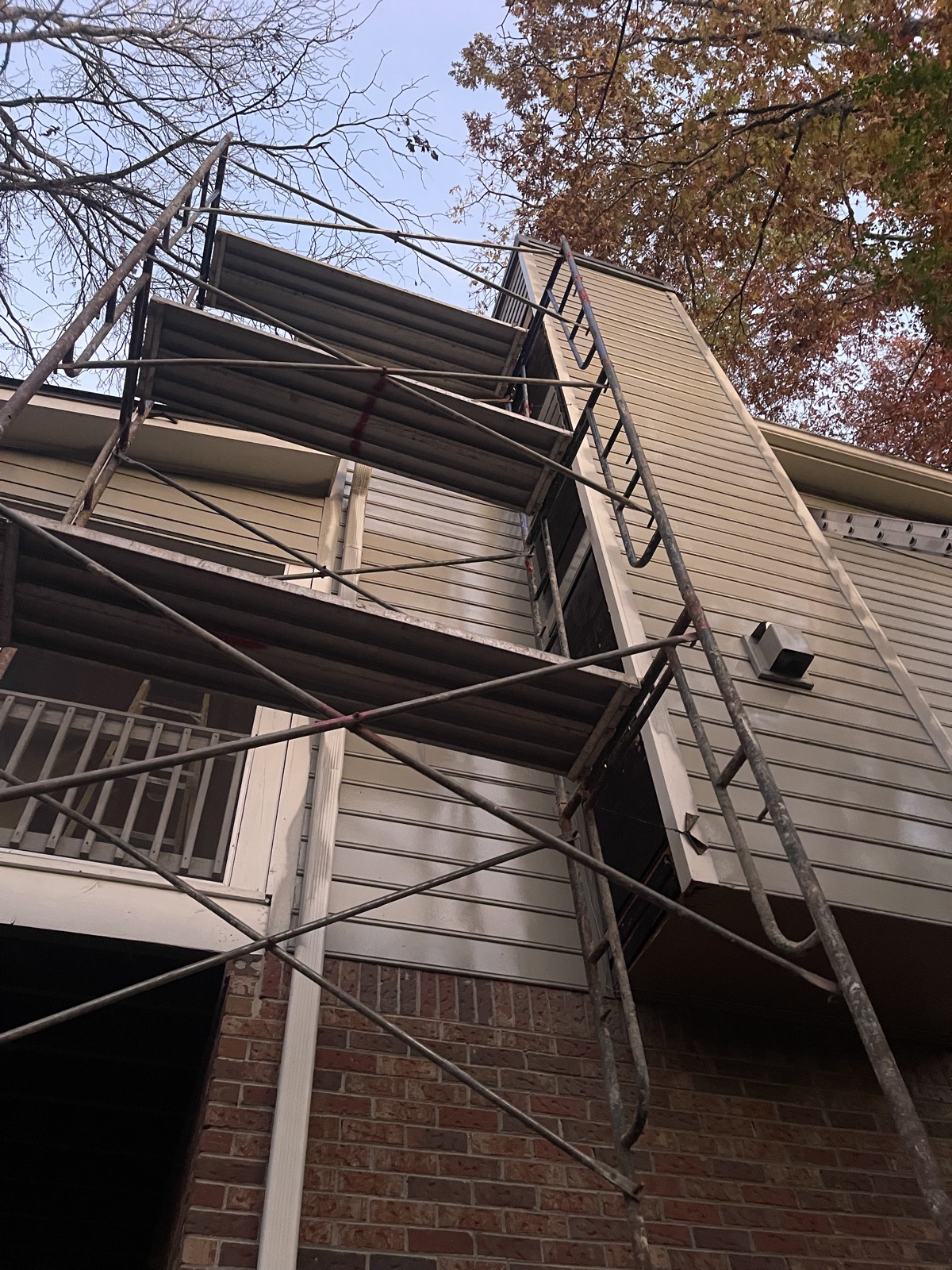 Exterior fascia, trim, chimney and siding repair with fresh paint