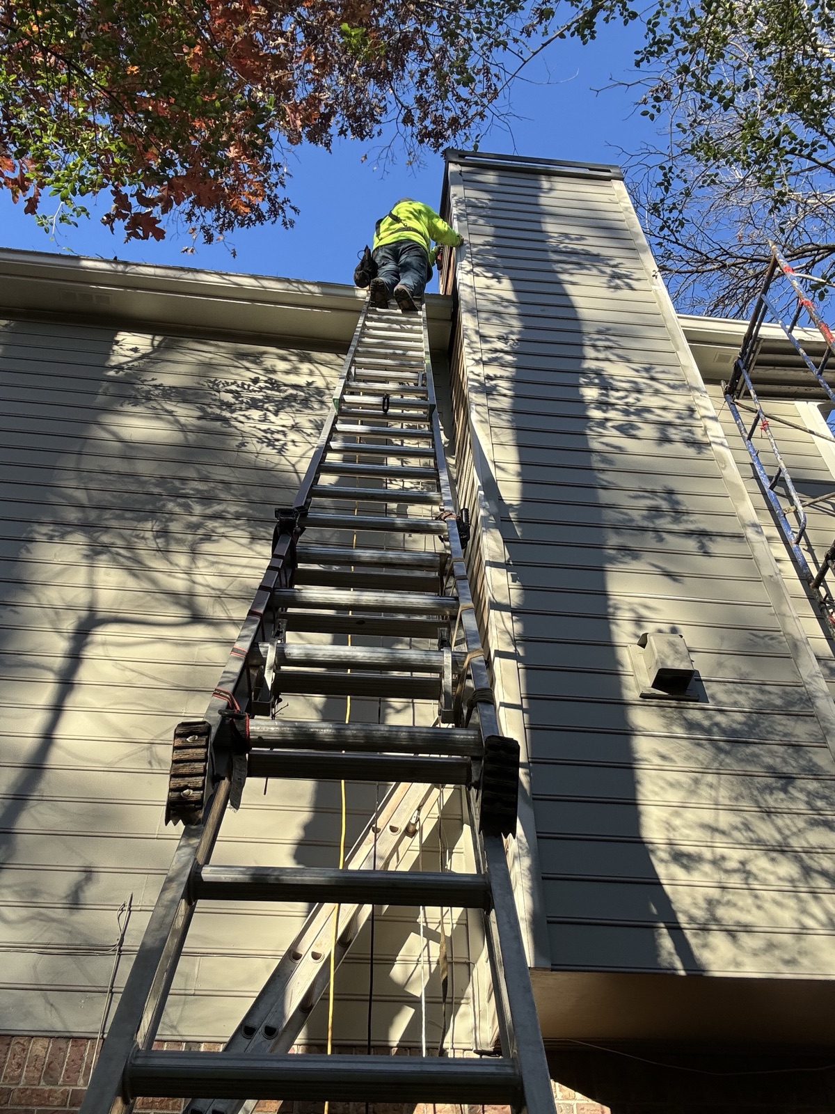Exterior fascia, trim, chimney and siding repair with fresh paint